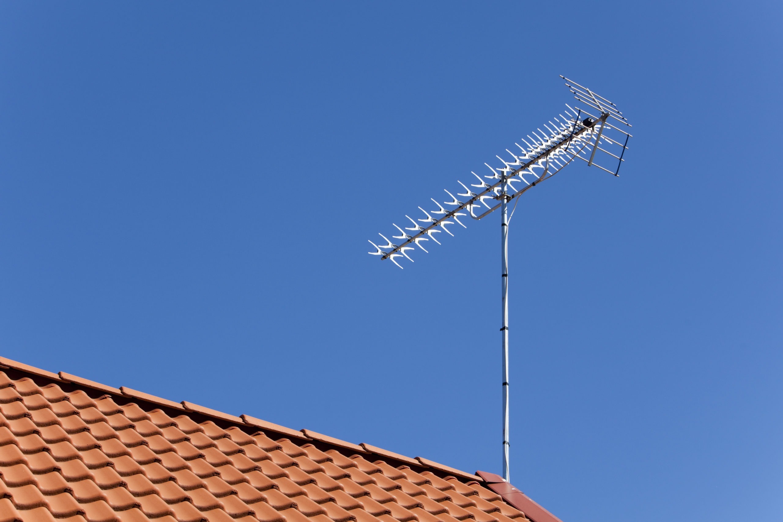A classic TV antenna on a roof top.Similar from my portfolio: