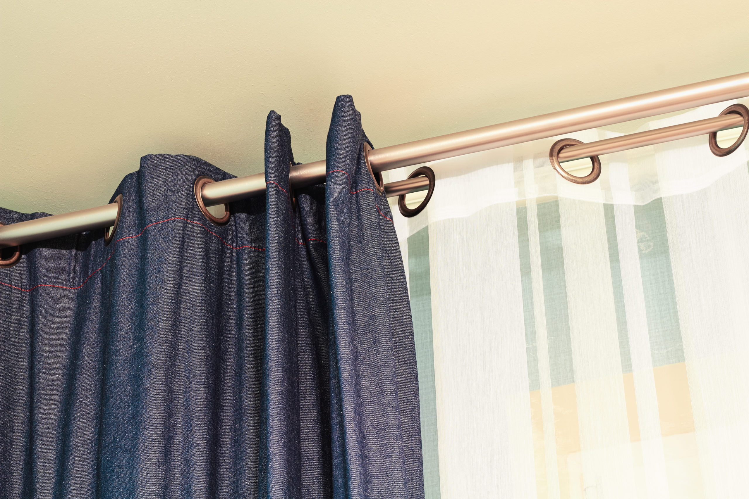 Denim  and white  curtains  with ring-top rail
