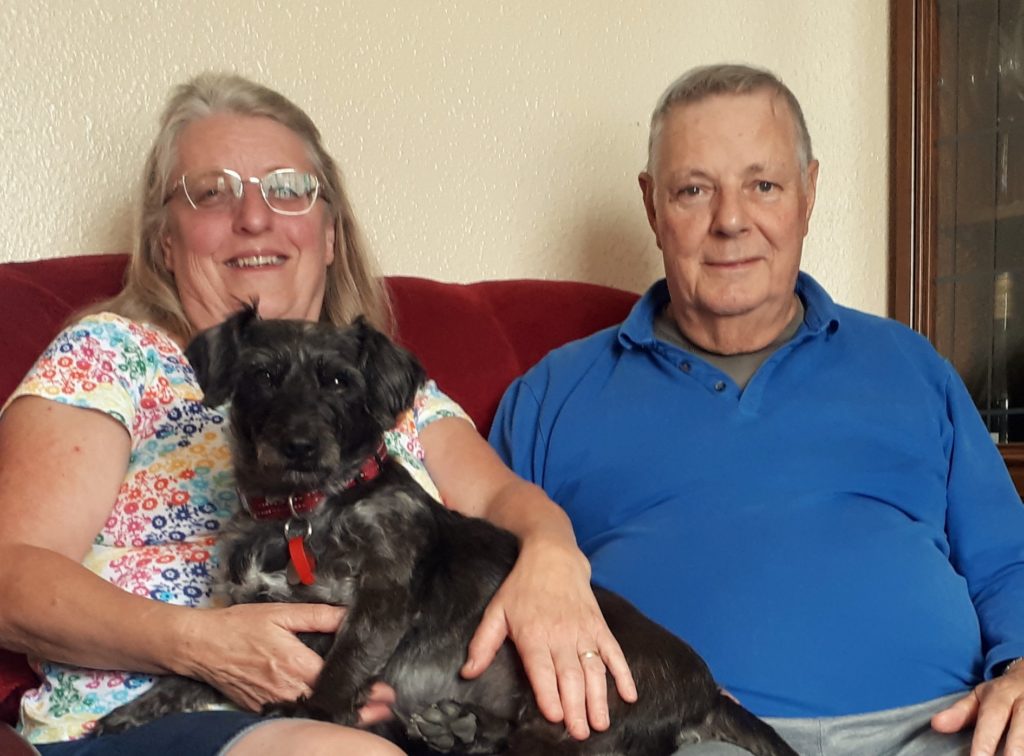 Photo of Selwood Housing customers Susan & Robert Coombes with Mike the dog.