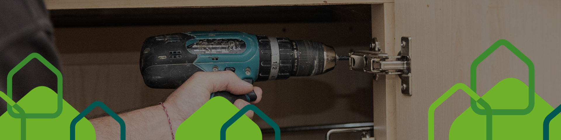 Selwood Housing operative using electric drill - regular servicing of your home