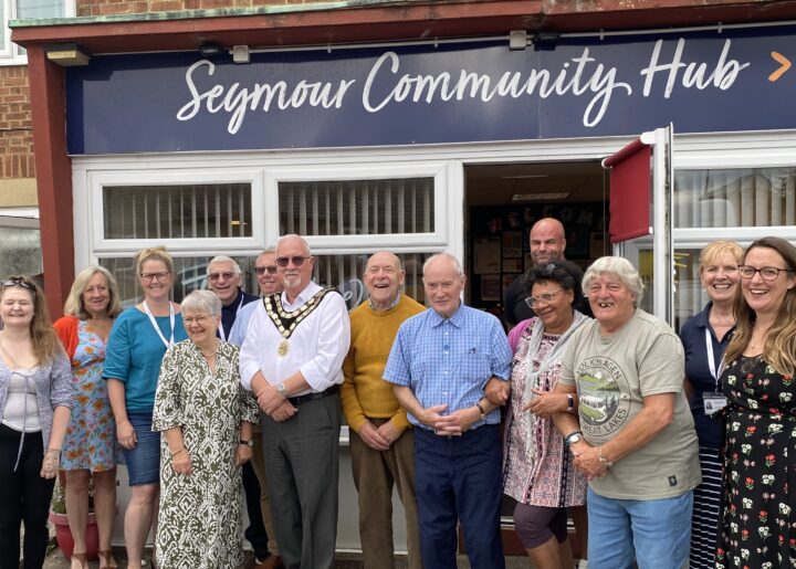 Mayor of trowbridge and locals stood outside the seymour community hub at opening event