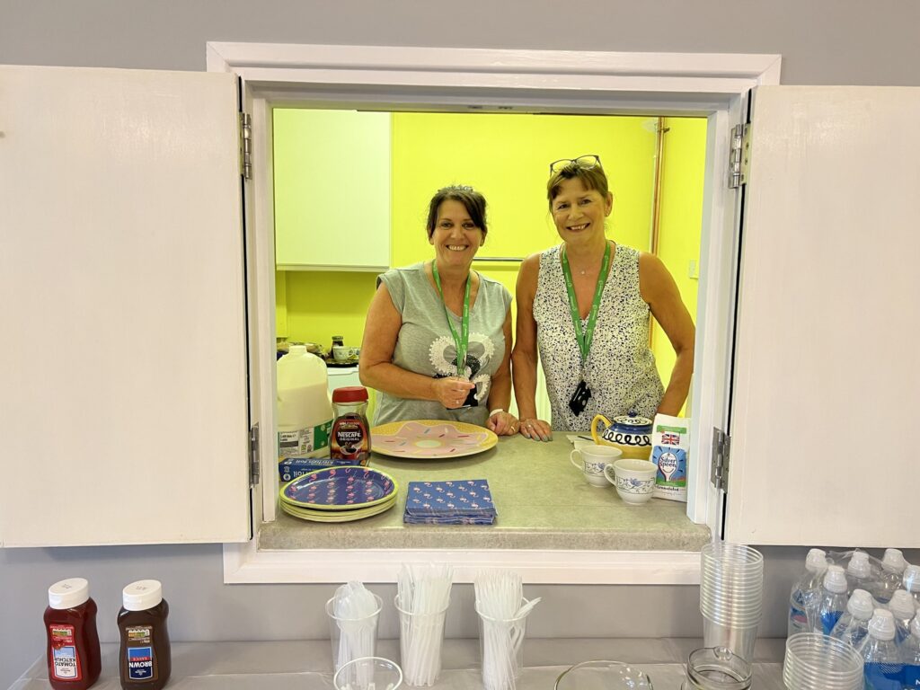 Vivienne Woodford and Paula Vidler in the kitchen at supported housing property for an event