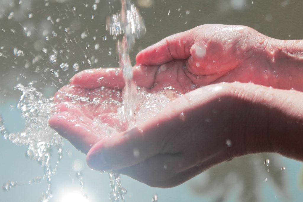 Running water going into someone's hands