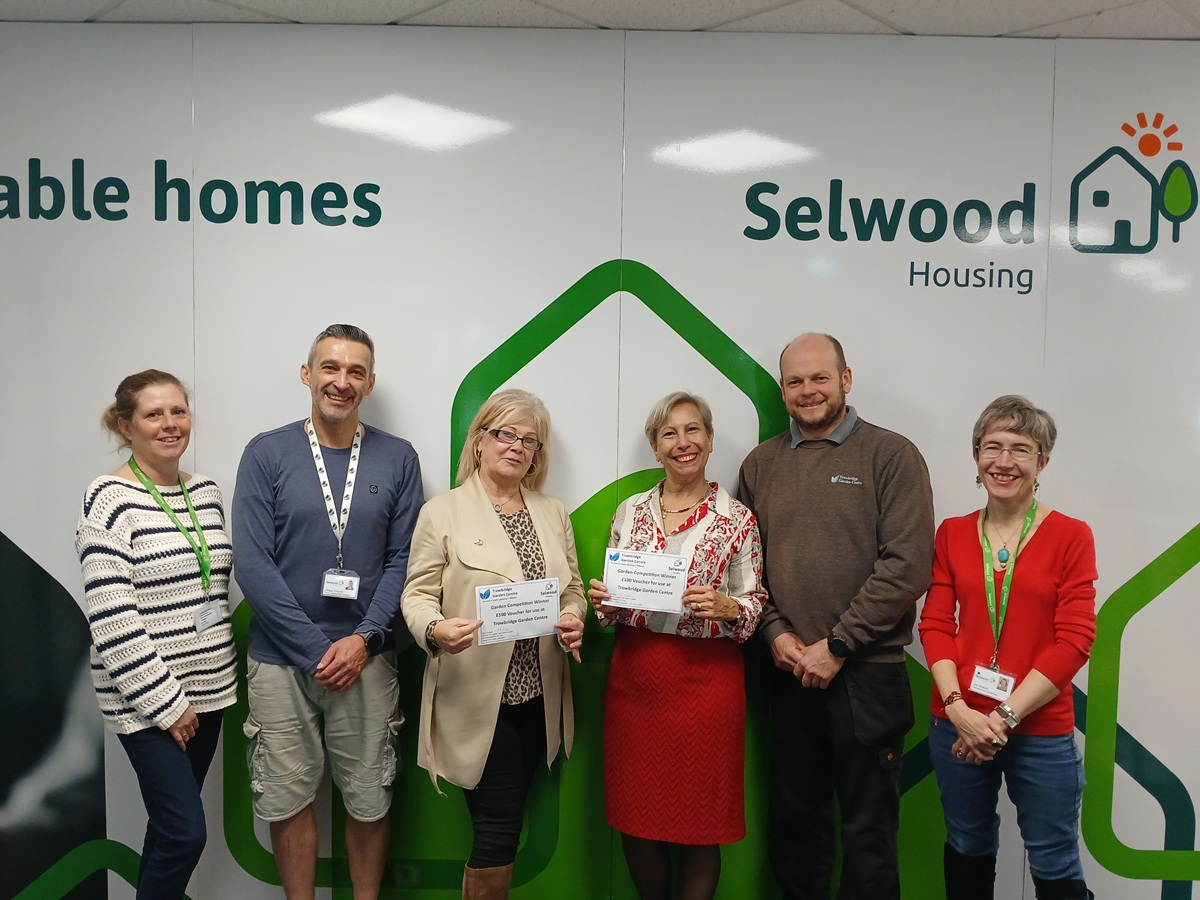Selwood Housing staff and Trowbridge Garden Centre presenting prizes to winners of Love Your Garden competition