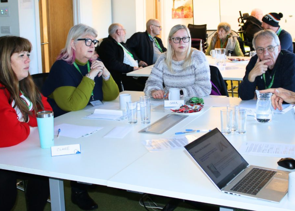 A group of involved customers taking part in a discussion