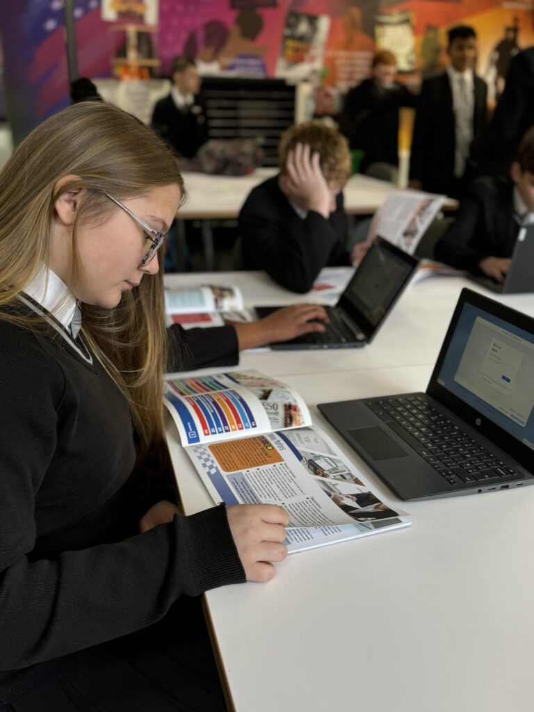 A student perusing the Moneywise brochure