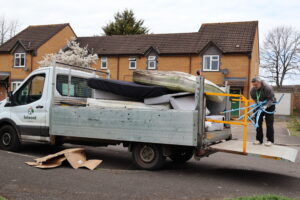Selwood Housing staff loading unwanted items onto a van during an estate clearance