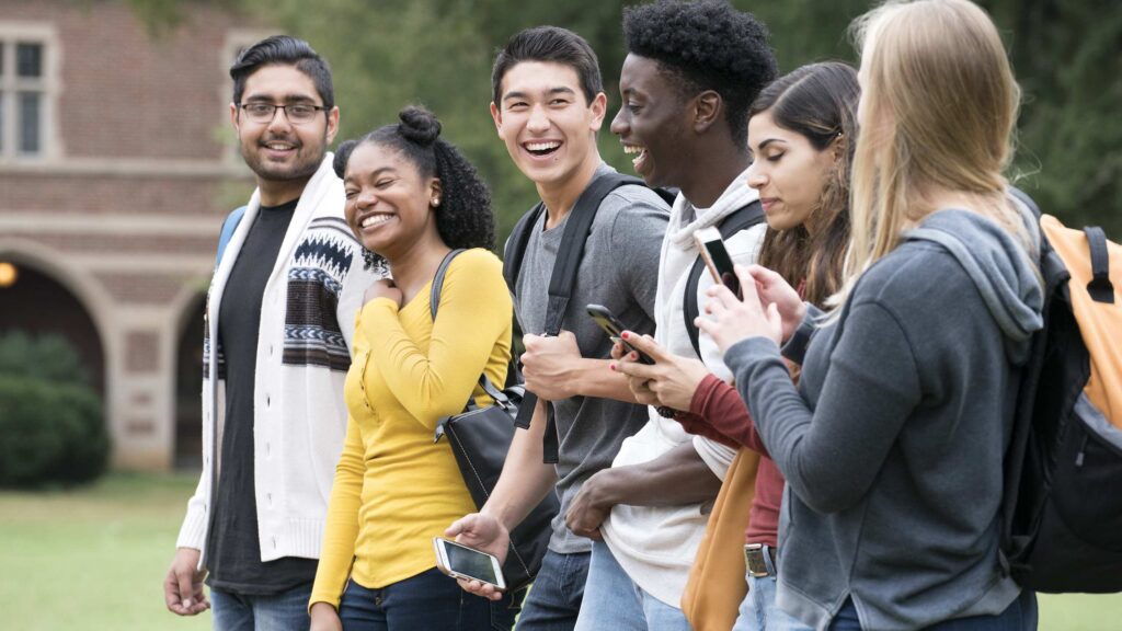 A group of young people walking and talking