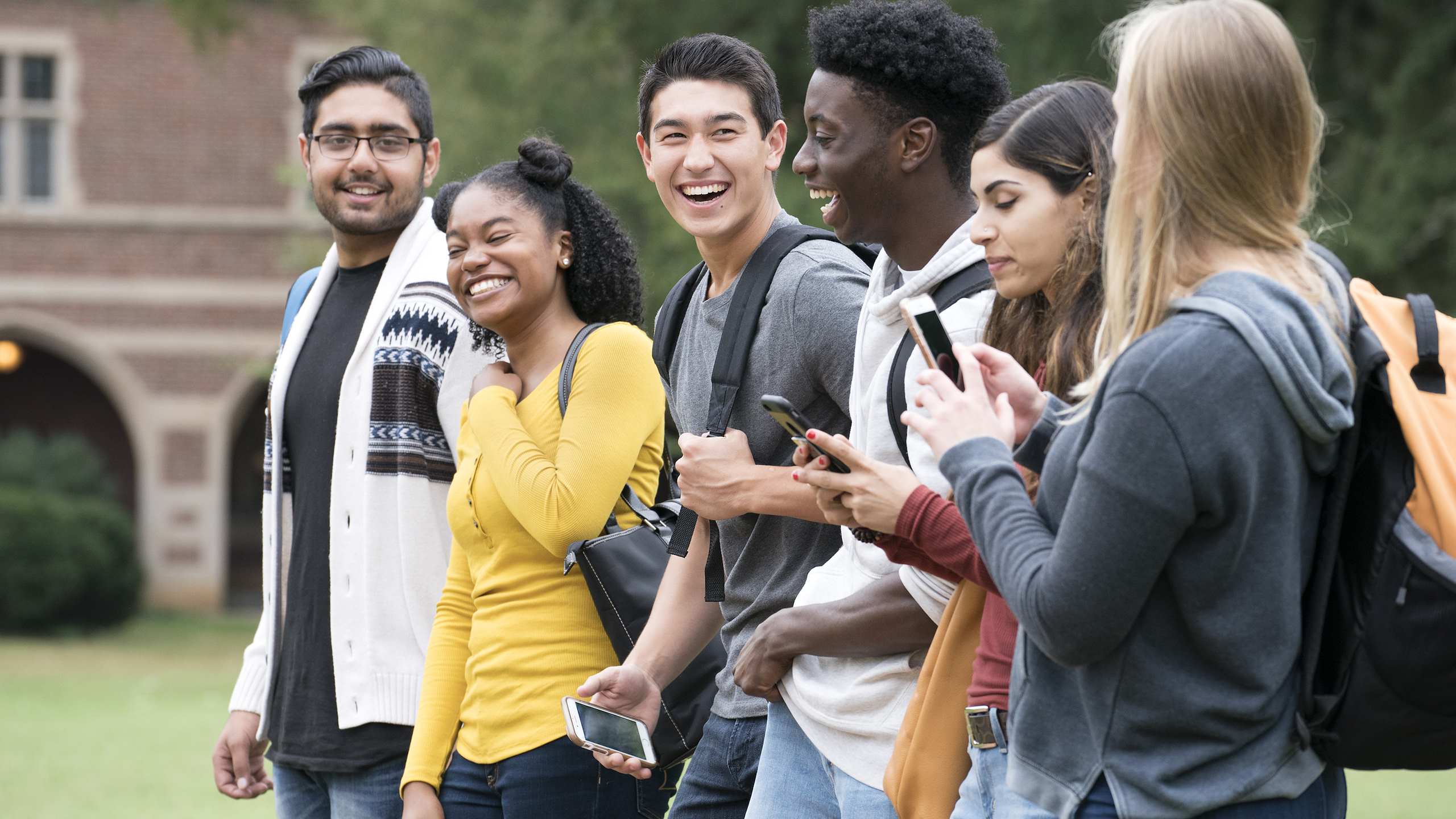 A group of young people walking and talking