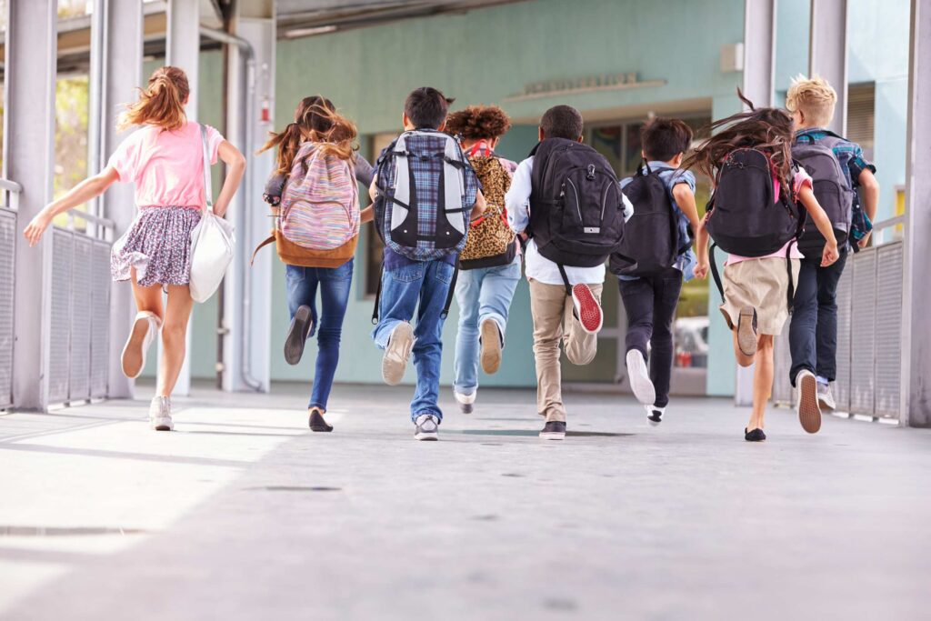 A group of young people running side by side